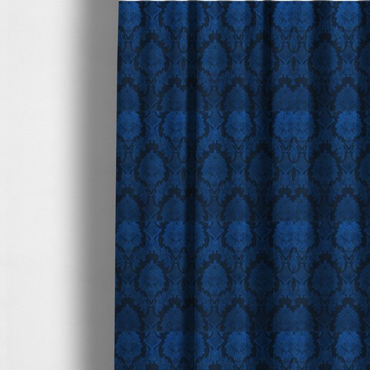 The fabric used to create these made-to-measure curtains is a high-contrast damask fabric featuring a vibrant royal blue floral medallion pattern over a deep navy blue background.