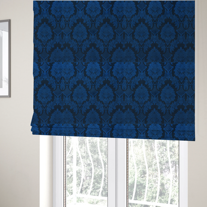 The fabric used to create these Roman blinds is a high-contrast damask fabric featuring a vibrant royal blue floral medallion pattern over a deep navy blue background.