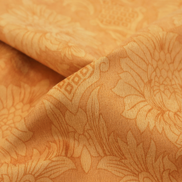 A bright apricot-orange damask fabric with a large-scale, repeating floral and acanthus leaf pattern in a soft tonal colourway.
