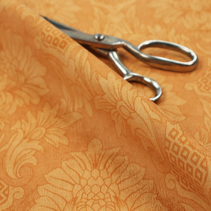 A bright apricot-orange damask fabric with a large-scale, repeating floral and acanthus leaf pattern in a soft tonal colourway.