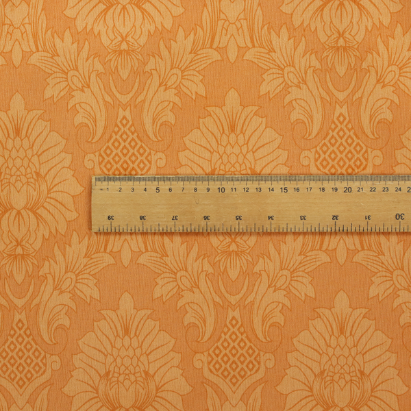 A bright apricot-orange damask fabric with a large-scale, repeating floral and acanthus leaf pattern in a soft tonal colourway.
