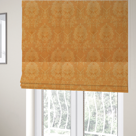 The fabric used to create these Roman blinds is a bright apricot-orange damask fabric with a large-scale, repeating floral and acanthus leaf pattern in a soft tonal colourway.