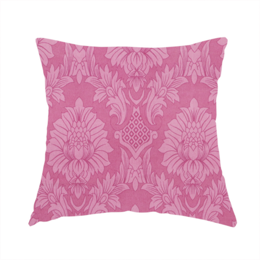 The fabric used to create this handmade cushion is a vibrant magenta damask fabric featuring a large-scale, repeating floral and acanthus leaf pattern in a tonal, hot pink colourway.