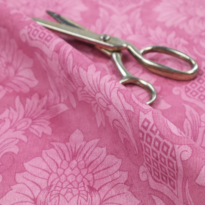 Vibrant magenta damask fabric featuring a large-scale, repeating floral and acanthus leaf pattern in a tonal, hot pink colourway.