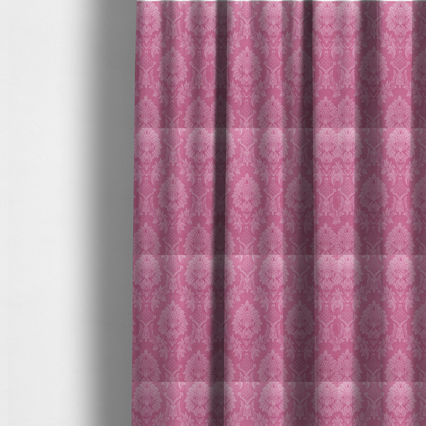 The fabric used to create these made-to-measure curtains is a vibrant magenta damask fabric featuring a large-scale, repeating floral and acanthus leaf pattern in a tonal, hot pink colourway.