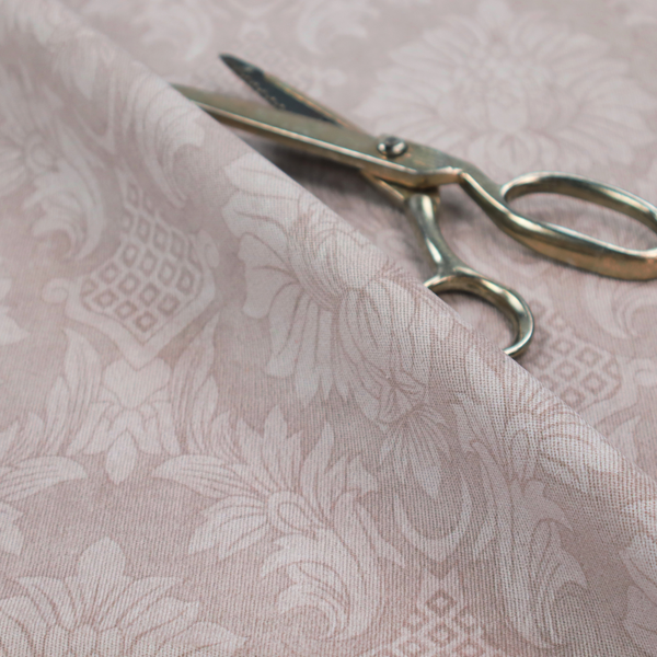 Subtle champagne and taupe damask fabric featuring a large-scale, repeating floral medallion pattern in a soft, shimmering tonal colourway.