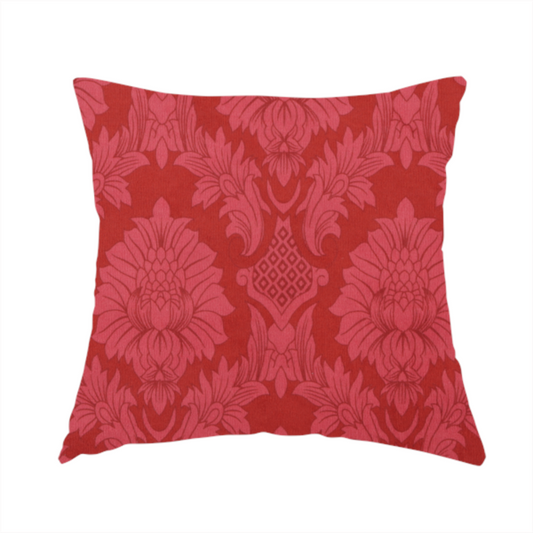 The fabric used to create this handmade cushion is a rich crimson red damask fabric featuring a large-scale, repeating floral and acanthus leaf pattern in a shimmering tonal colourway.