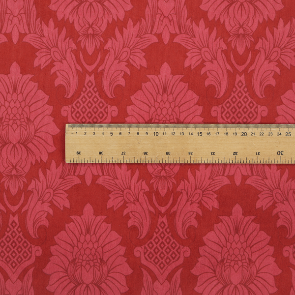 Rich crimson red damask fabric featuring a large-scale, repeating floral and acanthus leaf pattern in a shimmering tonal colourway.