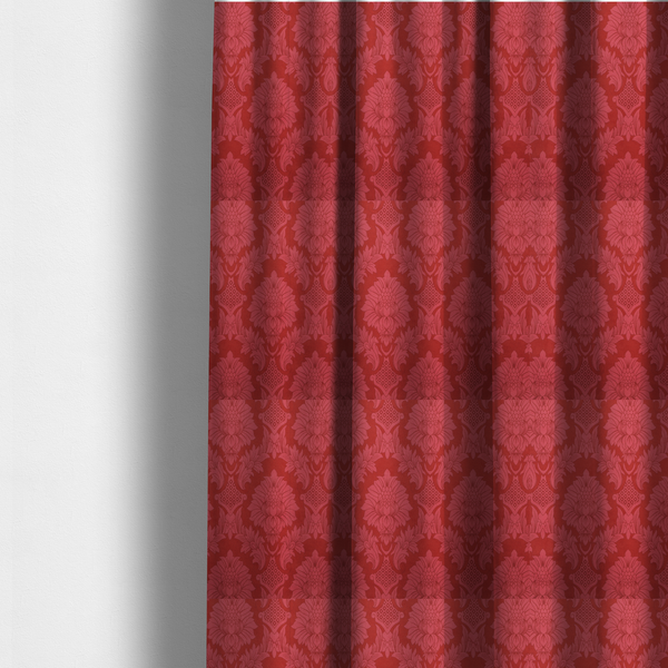 The fabric used to create these made-to-measure curtains is a rich crimson red damask fabric featuring a large-scale, repeating floral and acanthus leaf pattern in a shimmering tonal colourway.