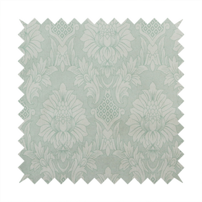 Elegant pale grey damask fabric featuring a large-scale, repeating floral medallion pattern in shimmering silvery-white tones.