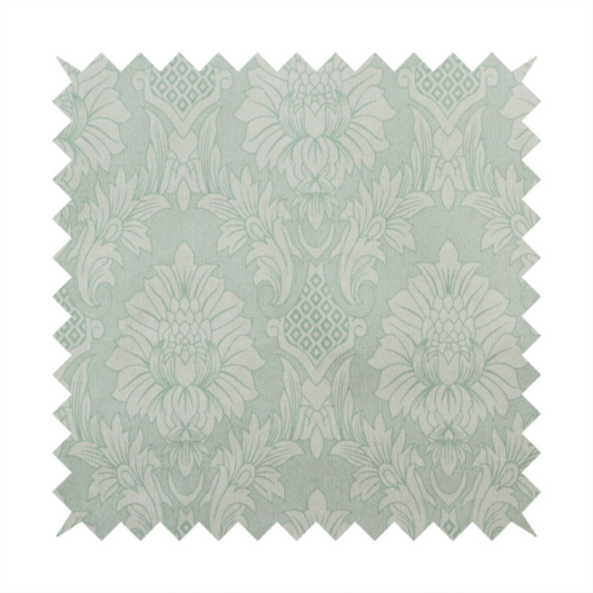 Elegant pale grey damask fabric featuring a large-scale, repeating floral medallion pattern in shimmering silvery-white tones.