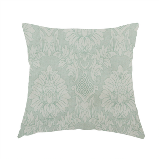 The fabric used to create this handmade cushion is a elegant pale grey damask fabric featuring a large-scale, repeating floral medallion pattern in shimmering silvery-white tones.
