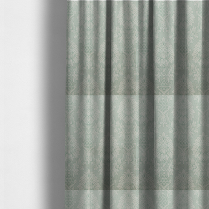 The fabric used to create these made-to-measure curtains is a elegant pale grey damask fabric featuring a large-scale, repeating floral medallion pattern in shimmering silvery-white tones.