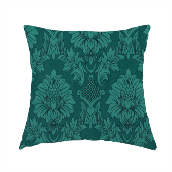 The fabric used to create this handmade cushion is a deep peacock teal damask fabric featuring a large-scale, repeating floral and acanthus leaf pattern in a rich, shimmering tonal colourway.