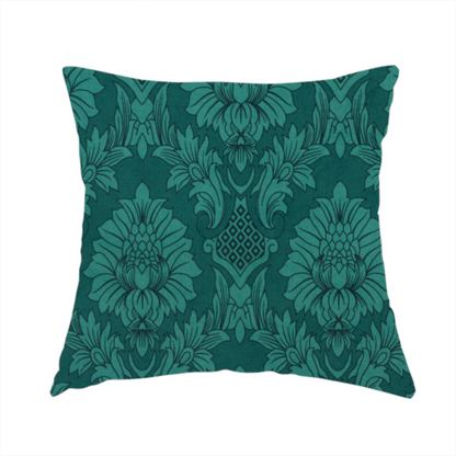The fabric used to create this handmade cushion is a deep peacock teal damask fabric featuring a large-scale, repeating floral and acanthus leaf pattern in a rich, shimmering tonal colourway.