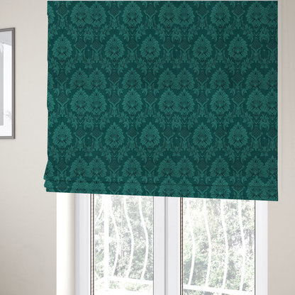The fabric used to create these Roman blinds is a deep peacock teal damask fabric featuring a large-scale, repeating floral and acanthus leaf pattern in a rich, shimmering tonal colourway.