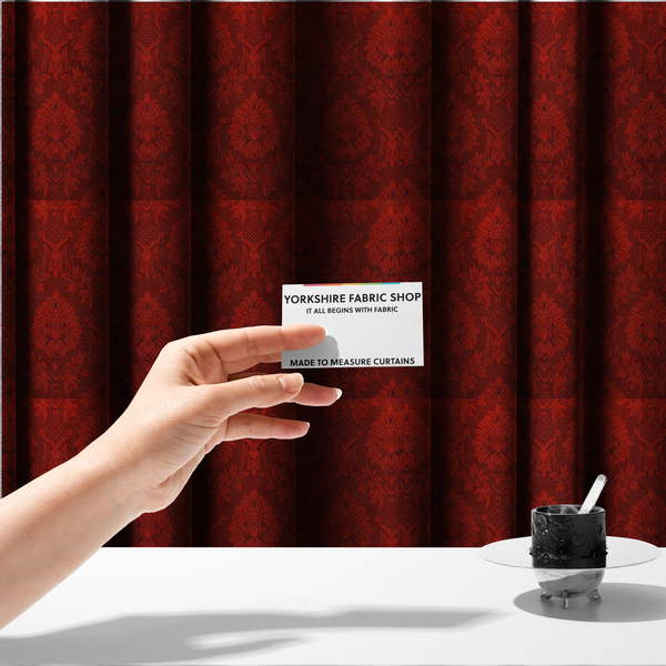 The fabric used to create these made-to-measure curtains is a deep burgundy damask fabric featuring a large-scale, repeating floral and acanthus leaf pattern in a dark, shimmering tonal colourway.