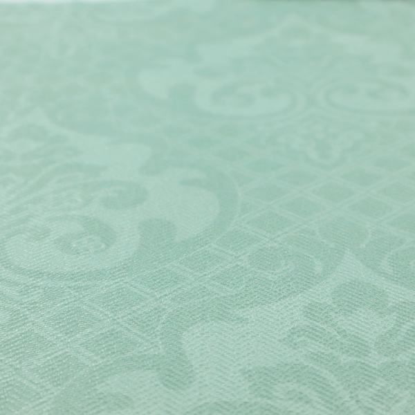 The design consists of large, ornate floral medallions and scrolling acanthus leaves woven in a shade very close to the background colour, creating a delicate, shimmering effect. A fine diagonal lattice grid fills the background between the motifs, and the material displays a clear woven texture throughout.