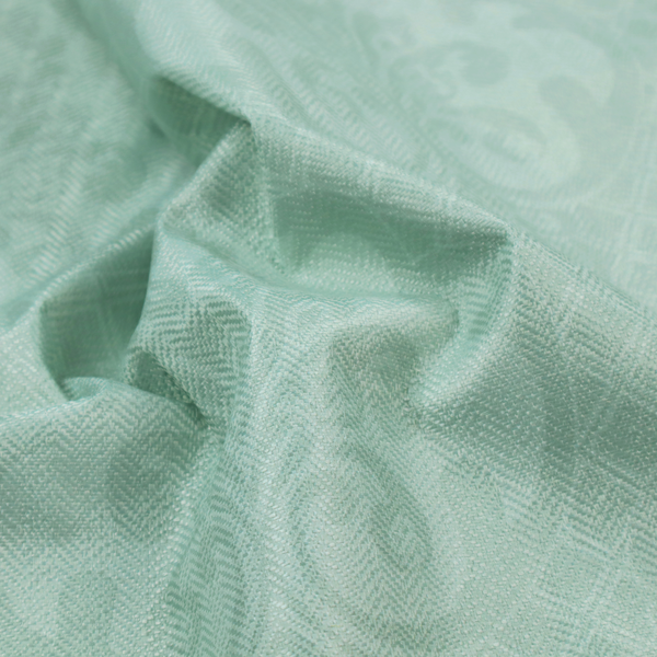 The design consists of large, ornate floral medallions and scrolling acanthus leaves woven in a shade very close to the background colour, creating a delicate, shimmering effect. A fine diagonal lattice grid fills the background between the motifs, and the material displays a clear woven texture throughout.