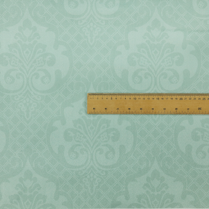 The design consists of large, ornate floral medallions and scrolling acanthus leaves woven in a shade very close to the background colour, creating a delicate, shimmering effect. A fine diagonal lattice grid fills the background between the motifs, and the material displays a clear woven texture throughout.