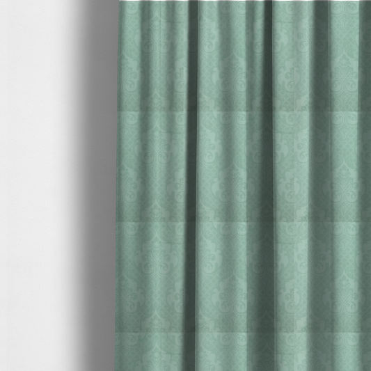 The fabric used to create these made-to-measure curtains has a design that consists of large, ornate floral medallions and scrolling acanthus leaves woven in a shade very close to the background colour, creating a delicate, shimmering effect. A fine diagonal lattice grid fills the background between the motifs, and the material displays a clear woven texture throughout.