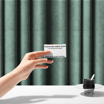 The fabric used to create these made-to-measure curtains has a design that consists of large, ornate floral medallions and scrolling acanthus leaves woven in a shade very close to the background colour, creating a delicate, shimmering effect. A fine diagonal lattice grid fills the background between the motifs, and the material displays a clear woven texture throughout.