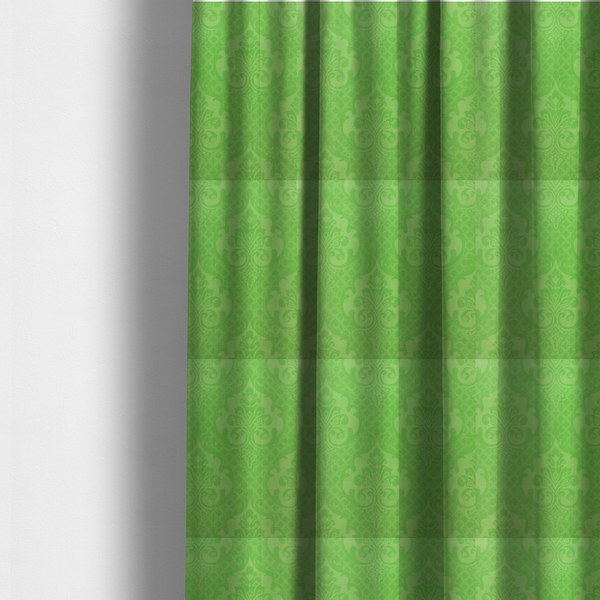 The fabric used to create these made-to-measure curtains has a design that features large, ornate floral medallions and scrolling acanthus leaves in a vibrant lime shade, set against a slightly lighter green background. A fine diagonal lattice grid fills the background between the motifs, and the material shows a clear woven texture that provides visual depth to the tonal design.