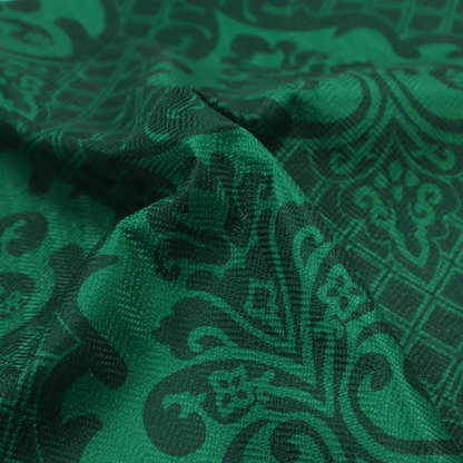 The design showcases large, ornate floral medallions and scrolling acanthus leaves in a vibrant green hue, set against a darker, forest green background. A fine diagonal lattice grid creates a diamond pattern in the spaces between the motifs, and the material displays a distinct woven texture that adds depth and classic character to the design.