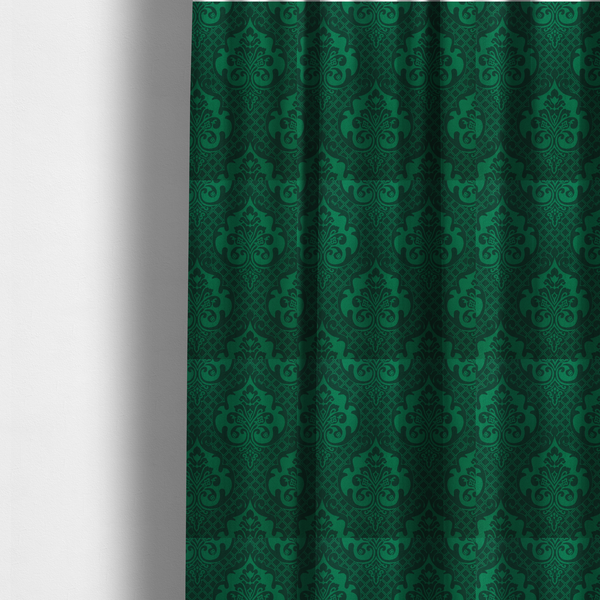 The fabric used to create these made-to-measure curtains has a design  that showcases large, ornate floral medallions and scrolling acanthus leaves in a vibrant green hue, set against a darker, forest green background. A fine diagonal lattice grid creates a diamond pattern in the spaces between the motifs, and the material displays a distinct woven texture that adds depth and classic character to the design.