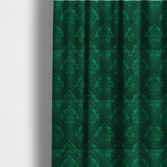 The fabric used to create these made-to-measure curtains has a design  that showcases large, ornate floral medallions and scrolling acanthus leaves in a vibrant green hue, set against a darker, forest green background. A fine diagonal lattice grid creates a diamond pattern in the spaces between the motifs, and the material displays a distinct woven texture that adds depth and classic character to the design.