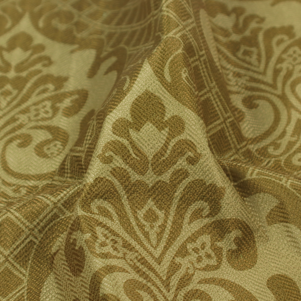 The design showcases large, ornate floral medallions and scrolling acanthus leaves in a muted tan shade, set against a rich ochre background. A fine diagonal lattice grid creates a diamond pattern in the spaces between the motifs, and the material displays a clear woven texture that adds depth and a subtle sheen to the pattern.