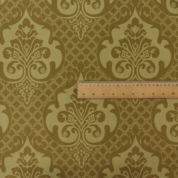 The design showcases large, ornate floral medallions and scrolling acanthus leaves in a muted tan shade, set against a rich ochre background. A fine diagonal lattice grid creates a diamond pattern in the spaces between the motifs, and the material displays a clear woven texture that adds depth and a subtle sheen to the pattern.