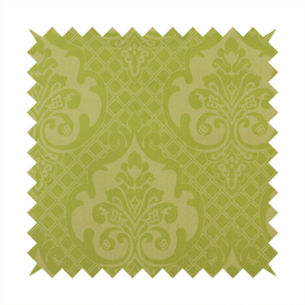 A lime green damask pattern on a textured fabric. The design features large, ornate floral medallions with stylized acanthus leaves, arranged in a repeating grid.