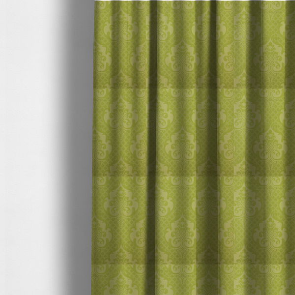 The fabric used to create these made-to-measure curtains has a lime green damask pattern on a textured fabric. The design features large, ornate floral medallions with stylized acanthus leaves, arranged in a repeating grid.