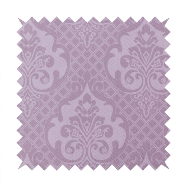 The design features large, ornate floral medallions and scrolling acanthus leaves in a light lavender shade, set against a slightly darker mauve background. A fine diagonal lattice grid fills the background between the motifs, and the material shows a clear woven texture that provides visual depth to the tonal design.