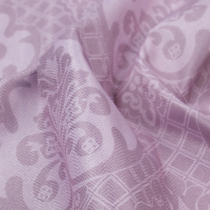 The design features large, ornate floral medallions and scrolling acanthus leaves in a light lavender shade, set against a slightly darker mauve background. A fine diagonal lattice grid fills the background between the motifs, and the material shows a clear woven texture that provides visual depth to the tonal design.