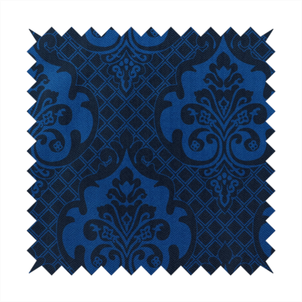 The design features large, ornate floral medallions and scrolling acanthus leaves in a bright royal blue shade, set against a deep navy background. A fine diagonal lattice grid fills the space between the motifs, and the material displays a clear woven texture that adds structural depth and a subtle sheen to the tonal blue design.