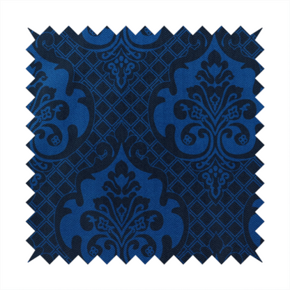 The design features large, ornate floral medallions and scrolling acanthus leaves in a bright royal blue shade, set against a deep navy background. A fine diagonal lattice grid fills the space between the motifs, and the material displays a clear woven texture that adds structural depth and a subtle sheen to the tonal blue design.