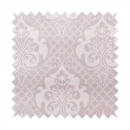 A baby pink and cream damask pattern on a textured fabric. The design features large, ornate floral medallions with stylized acanthus leaf scrolls, arranged in a structured, repeating grid.
