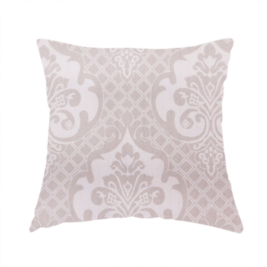 The fabric used to create this handmade cushion has a baby pink and cream damask pattern on a textured fabric. The design features large, ornate floral medallions with stylized acanthus leaf scrolls, arranged in a structured, repeating grid.