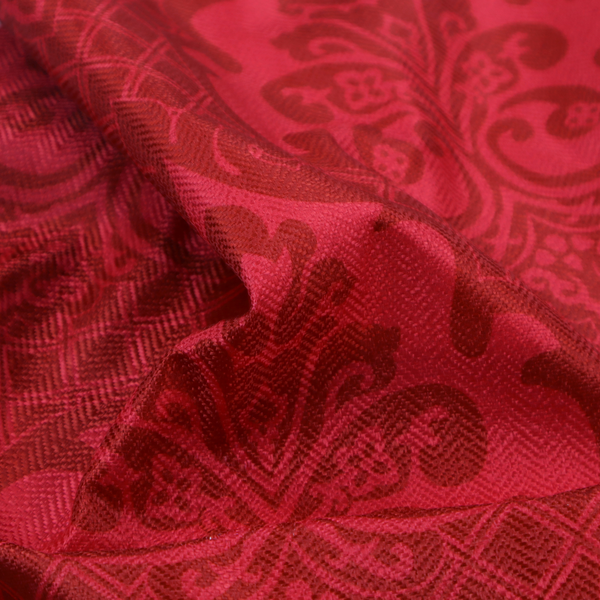 The design features large, ornate floral medallions and scrolling acanthus leaves in a slightly lighter shade of red, creating a tonal, high-contrast effect. A fine diagonal lattice grid fills the background between the motifs, and the material shows a clear woven texture that adds depth and a traditional feel to the design.