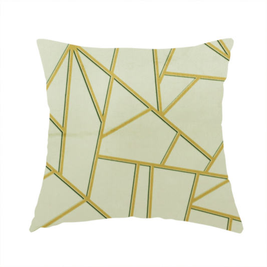 The fabric used to create this handmade cushion is a geometric, fractured glass pattern. The design consists of irregular, sharp-angled polygons in a pale sage green or muted seafoam hue. These shapes are separated by thick, shimmering gold metallic lines that appear slightly recessed or embossed, creating a high-contrast, mosaic-like effect.