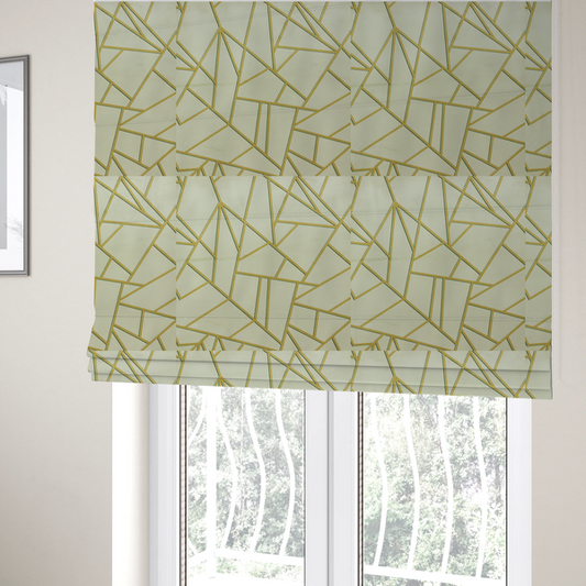 The fabric used to create these Roman blinds features a geometric, fractured glass pattern. The design consists of irregular, sharp-angled polygons in a pale sage green or muted seafoam hue. These shapes are separated by thick, shimmering gold metallic lines that appear slightly recessed or embossed, creating a high-contrast, mosaic-like effect.