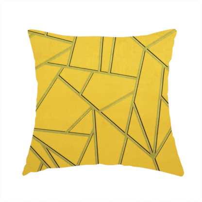 The fabric used to create this handmade cushion is a luxurious mustard yellow fabric featuring a bold geometric, fractured pattern. The design is composed of sharp, irregular polygons separated by embossed tone-on-tone lines in a slightly darker, olive-tinted gold.