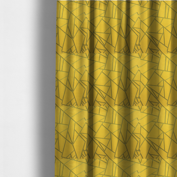 The fabric used to create these made-to-measure curtains is a luxurious mustard yellow fabric featuring a bold geometric, fractured pattern. The design is composed of sharp, irregular polygons separated by embossed tone-on-tone lines in a slightly darker, olive-tinted gold.