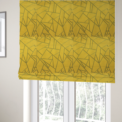 The fabric used to create these Roman blinds is a luxurious mustard yellow fabric featuring a bold geometric, fractured pattern. The design is composed of sharp, irregular polygons separated by embossed tone-on-tone lines in a slightly darker, olive-tinted gold.