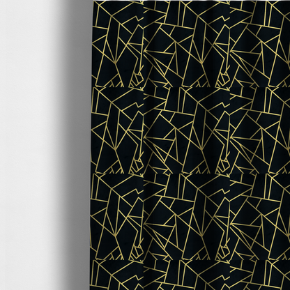 The fabric used to create these made-to-measure curtains is a high-contrast black and gold fabric featuring a fractured, geometric mosaic design. The deep, matte black background is intersected by a network of sharp, metallic gold lines that form irregular, angular polygons. The pattern resembles a web of shimmering gold veins or a stylized shattered-glass effect, giving the textile a luxurious, Art Deco-inspired aesthetic.