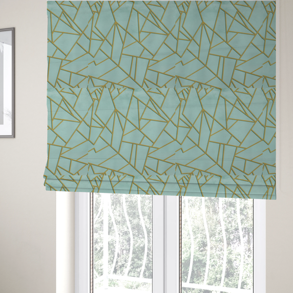 The fabric used to create these Roman blinds is a luxurious light aqua or pale sky blue fabric featuring a fractured, geometric mosaic pattern. The soft, matte background is segmented by a network of embossed metallic gold lines that create sharp, irregular polygons. This "cracked ice" or shattered-glass effect pairs a serene, cool-toned pastel with warm, shimmering gold linework for a sophisticated and modern Art Deco-inspired look.