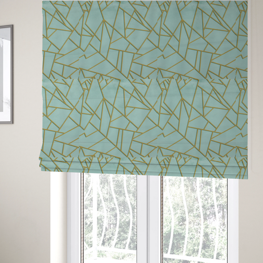 The fabric used to create these Roman blinds is a luxurious light aqua or pale sky blue fabric featuring a fractured, geometric mosaic pattern. The soft, matte background is segmented by a network of embossed metallic gold lines that create sharp, irregular polygons. This "cracked ice" or shattered-glass effect pairs a serene, cool-toned pastel with warm, shimmering gold linework for a sophisticated and modern Art Deco-inspired look.