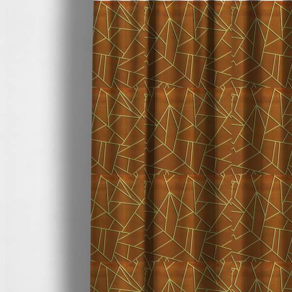 The fabric used to create these made-to-measure curtains is a luxurious brown or rust-coloured fabric featuring a fractured, geometric mosaic pattern. The warm, matte background is divided by a network of recessed gold metallic lines that form sharp, irregular polygons. This "cracked ice" or shattered-glass effect creates a bold, architectural look, blending the deep, earthy tones of the textile with shimmering, Art Deco-inspired accents.
